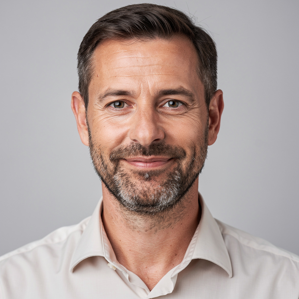 Studio portrait of a bearded man in a shirt